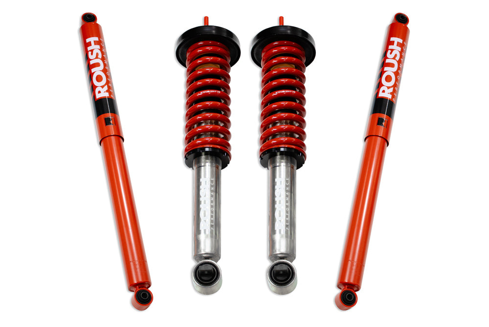 
                  
                    Red and black Roush Performance Suspension shock absorbers and coil springs are arranged against a white background, showcasing the enhanced off-road capability specifically designed for F-150 trucks.
                  
                